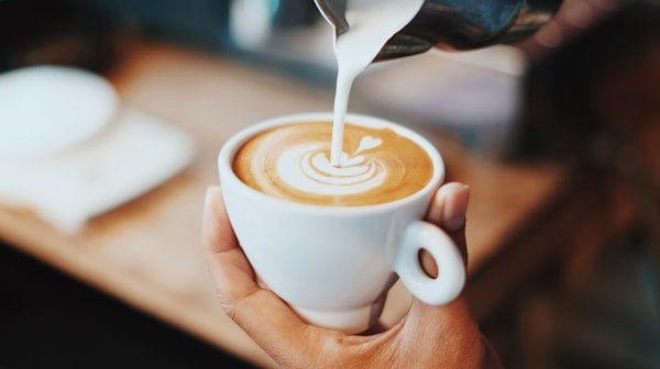 Latte art being poured